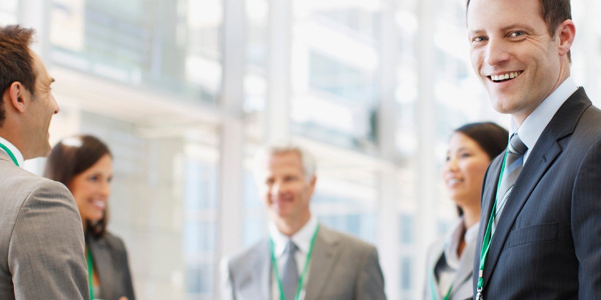 Smiling business people engaged in conversation