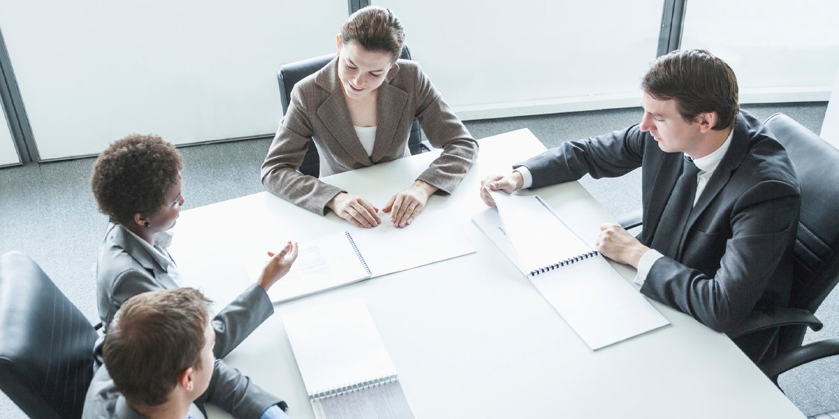 Diverse group of business people sitting at a conference table