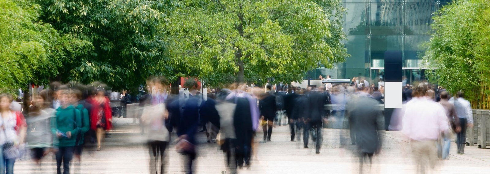 Blurred image of people walking in a city