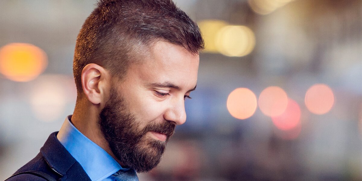 Close-up of a bearded man in a suit