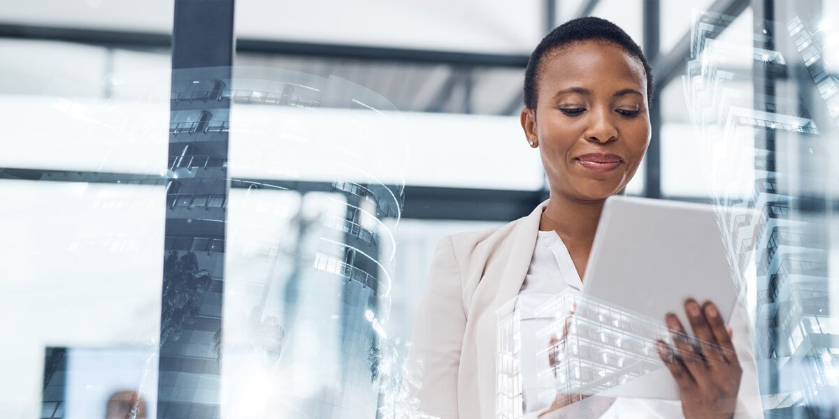 Professional woman in a light blazer using a tablet