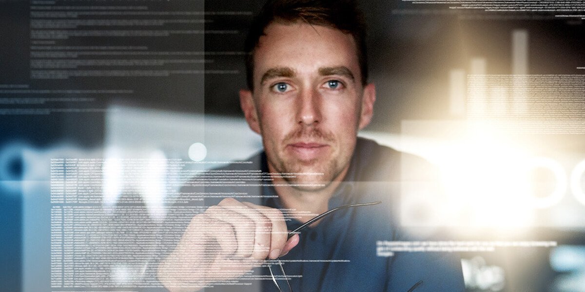 A man analyzing data on a computer screen